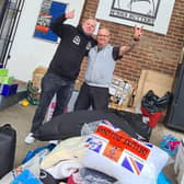Volunteer Jon Andrews (left) with Polish helper Artur Blaziak, surrounded by donations at the Monks Buttery pub in Kings Langley.