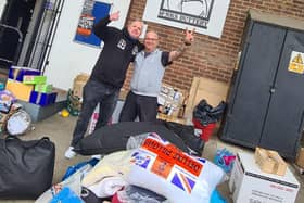 Volunteer Jon Andrews (left) with Polish helper Artur Blaziak, surrounded by donations at the Monks Buttery pub in Kings Langley.
