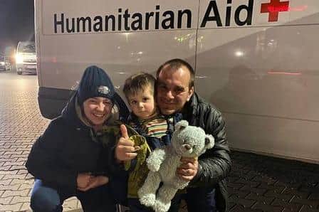 The Ukrainian family Paul helped by driving them from the Polish border to a place of safety in the Czech Republic. They are (from right), single dad Sergei, his two-year-old son Mark, with a teddy bear given to him by Paul, and Sergei's sister, Olga.