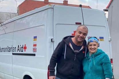 Paul and his van with Marta, the lady who is running the refuge centre for women and children in Bielawa, Poland.