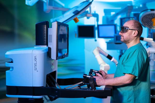 A surgeon at the console of the system. PIC: cmrsurgical.