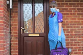 A Rennie Grove nurse dressed in PPE