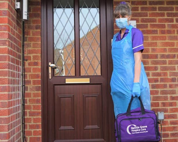 A Rennie Grove nurse dressed in PPE