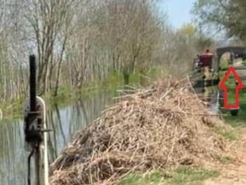 Police have released this image showing a dog walker by the canal