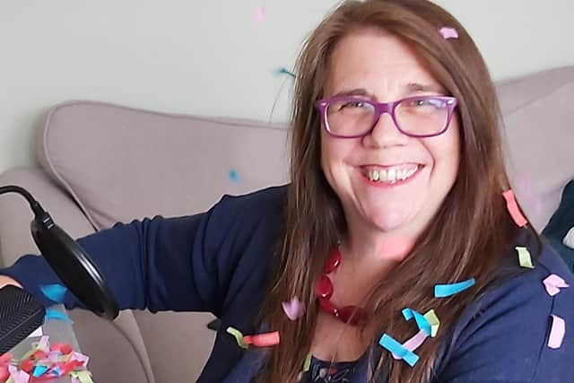 Kerry Brabant, founder of Herts Musical Memories celebrating the news as she finishes her online singing session