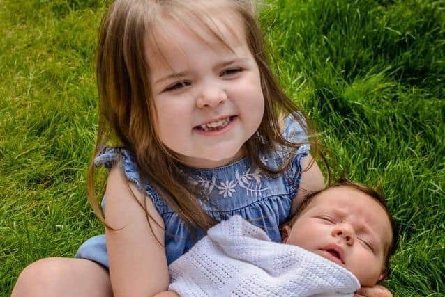 Cuddles with big sister Lola