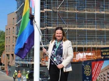 Council Chief Executive Claire Hamilton raises the flag for Pride Month
