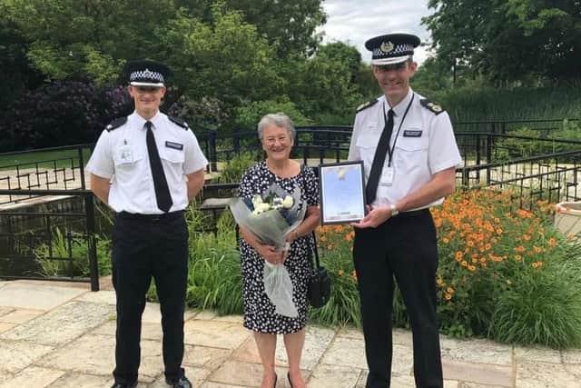 Superintendent Matt Phillips, Sue Thompson and Chief Constable Charlie Hall