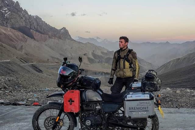 Jack standing atop a freezing mountain pass at dusk, in the far south of Xinjiang Province and within sight of K2 (C) Simon Double