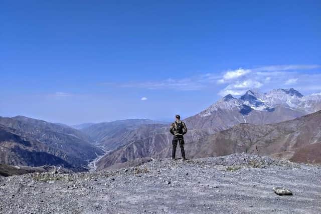 Jack surveying Kazarman Pass in Krygyzstan (C) Simon Double