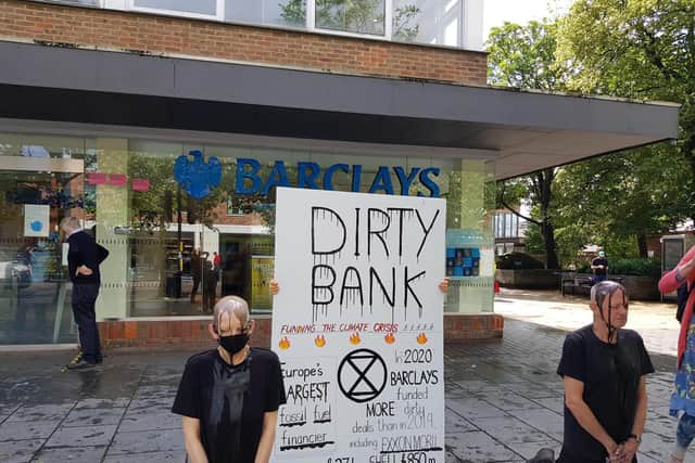 Environmental protesters target Barclays with 'dirty protest' (C) Clare Hobba