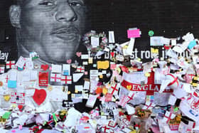 Messages of support were placed on a mural of Marcus Rashford - who was the target of racist abuse, along with other Black players, after the Euro 2020 final. Pic: Getty