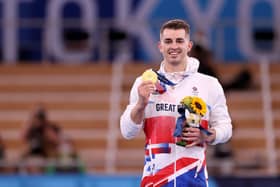 Hemel Hempstead's Max Whitlock shows off his gold medal after retaining his Olympic pommel horse title in Tokyo. Pictures by Jamie Squire/Getty Images