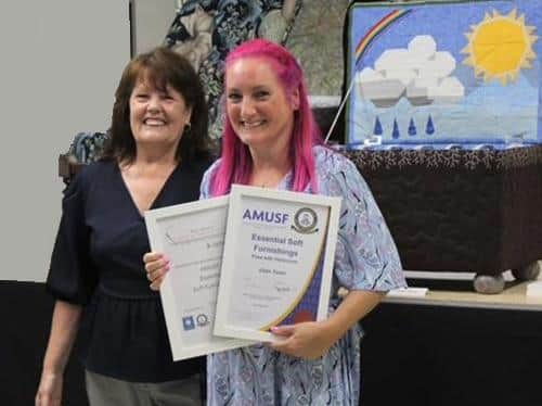Maggi Loughran presenting a certificate to Elain Toner