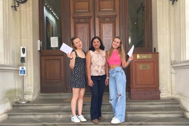 Holly Lavery (left), who achieved Theatre Studies A, Photography B and Film Studies C, and Eva Young (right), who achieved Biology A*, Business A, Geography A* with Dr Anu Mahesh (centre), the school's Deputy Director of Academic Studies, and Head of Science and Maths