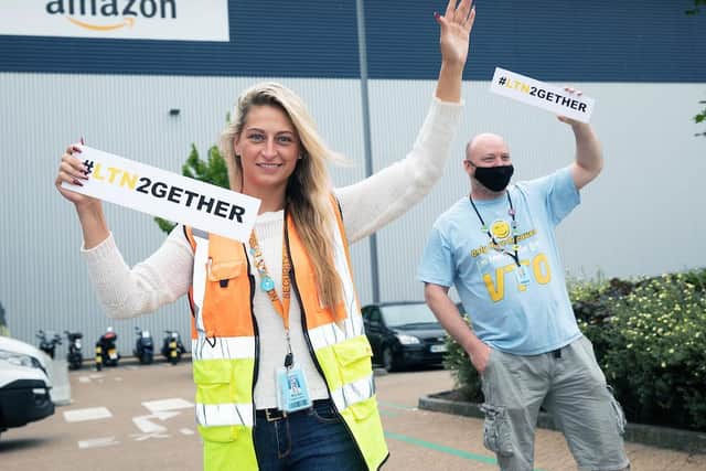 Colleagues from Amazon met Richard at the finishing line to celebrate his success and cheer him on