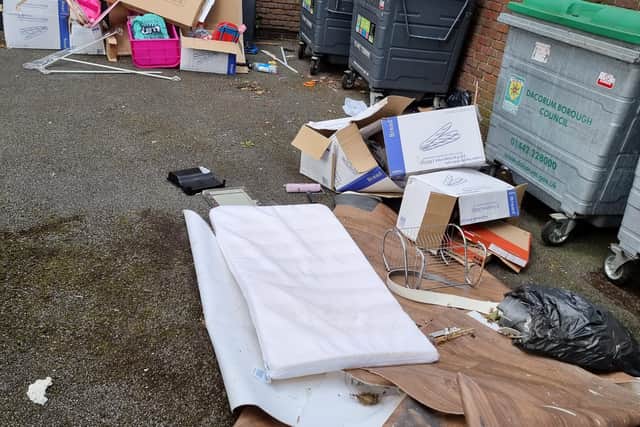 The rubbish was dumped between the two small blocks of flats on London Road