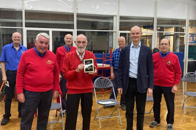 John Green with the thank-you trophy presented by chairman John