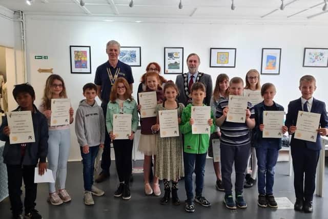 Back row: President of Berkhamsted Rotary, John Whiteley, Artist and Judge Mary Casserley and Berkhamsted Mayor Cllr Stephen Claughton. Front row: Far right, 1st prize winner Laurence Blythe; 4th from left 2nd prize winner Poppy Rogers; 3rd from left 3rd prize winner Archie Thompson.