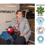 A happy Shopmobility Customer picking up their hired scooter