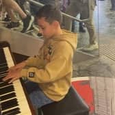 Max playing to the crowds in Euston Station.