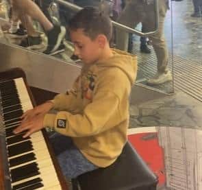 Max playing to the crowds in Euston Station.