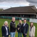 Rebecca Rooker, Chris Bozzmoss and Deirdre Brennan from Taylor Wimpey South Midlands photographed with Richard Smith, Chairman at the Football Club, and Nikki Dutton, one of the club's volunteers