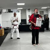 Shihan Chris receives his 6th Dan Black Belt Certificate