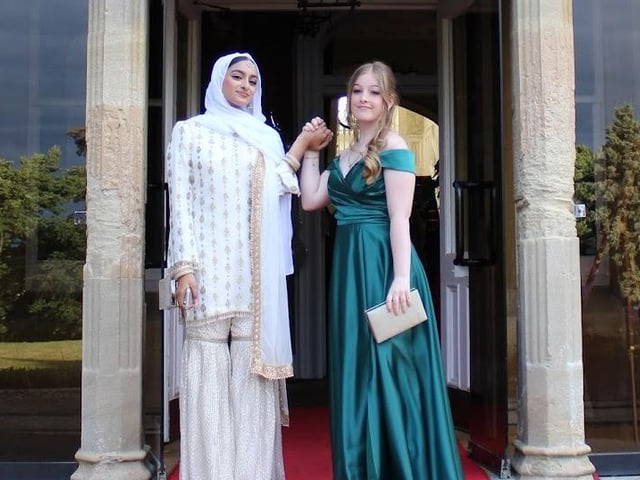 Two friends pose on the steps of Shendish Manor.
