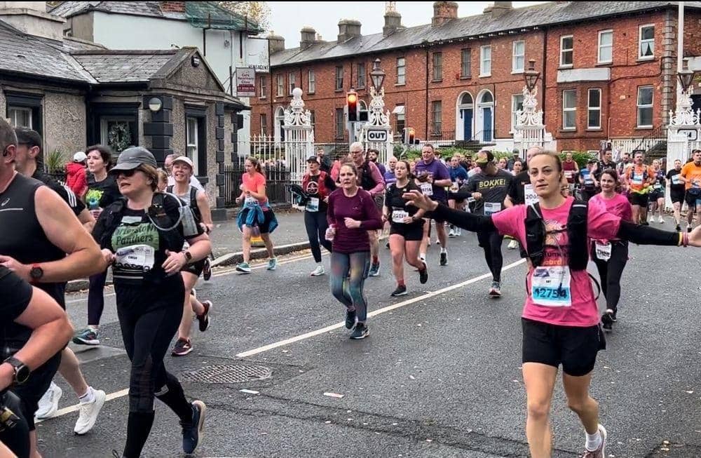 Amy in her charity t-shirt back left running Dublin Marathon