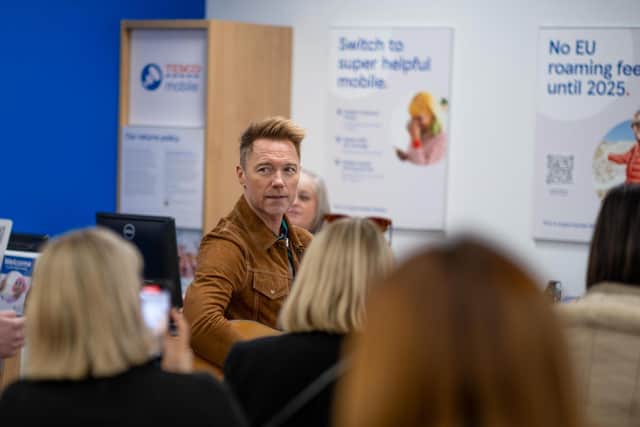 The former Boyzone frontman is visiting other mobile stores