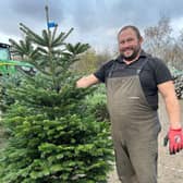 Martin displays one of the trees for sale at The Hospice of St Francis