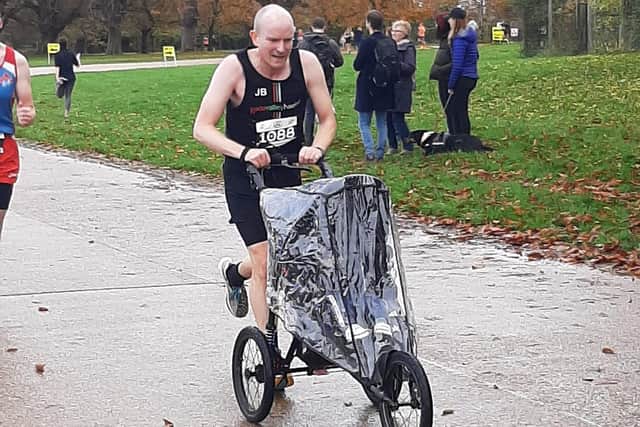 James Birnie approaching the finish with baby Will at Knebworth