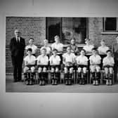 The 1949 Victoria School football team. Former member Ken Potter would like to know the names of the two boys on the right in the front row and the sports master