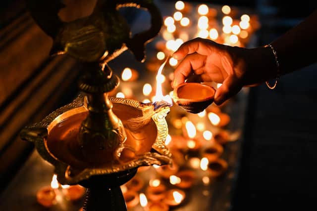 Diwali at a temple. (Photo by ISHARA S. KODIKARA / AFP) (Photo by ISHARA S. KODIKARA/AFP via Getty Images)