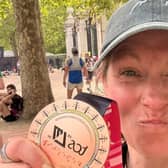 Sarah Dolling with her medal after completing the London Marathon