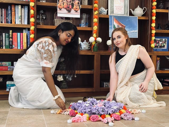 Pranali and Bailey create a beautiful flower carpet
