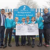 Yassas Jayasinghe, Tesco Northchurch Express Store Manager, presents the cheque to pupils at Bridgewater School and their Headteacher Andrea Bettridge