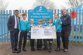 Yassas Jayasinghe, Tesco Northchurch Express Store Manager, presents the cheque to pupils at Bridgewater School and their Headteacher Andrea Bettridge