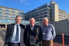 Hemel MP Sir Mike Penning (centre)