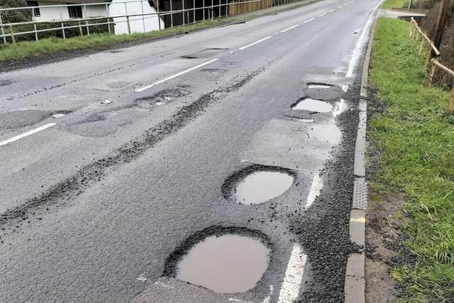 Potholes spotted in nearby Buckinghamshire used for illustrative purposes