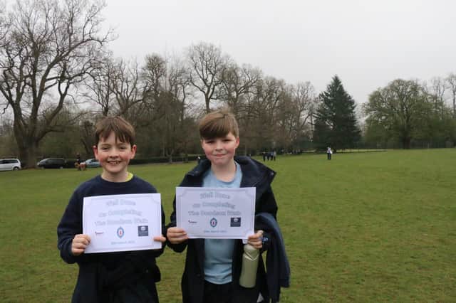 Pupils with their certificates after finishing the walk.