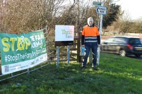 NFU Hertfordshire Chair Robert Law with a Stop the Family Farm Tax banner.