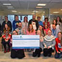 Hightown staff will hand over £5,345 to the Trussell Trust in time for Christmas