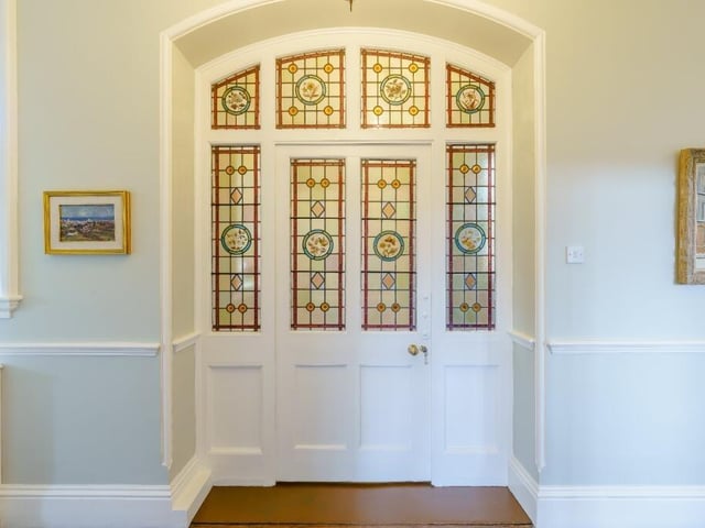The property has some really detailed elements - like this stained glass door and windows.
