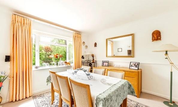 Next to the spacious living room and kitchen is the homely dining room.
