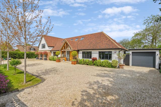 This beautiful contemporary family home is located on a 0.6 acre plot on a private road, backing on to fields.