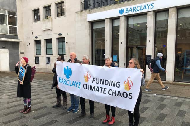 The activists outside the bank yesterday (November 14)