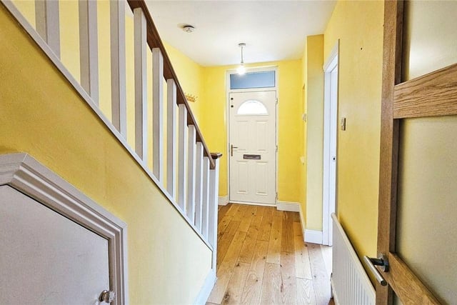 Stepping in, you will be greeted by a charming entrance hall with smart wooden floors leading to an open plan reception area.