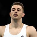 Max Whitlock reacts after his routine on the high bar during the men's team final in Paris. (Photo by Naomi Baker/Getty Images)